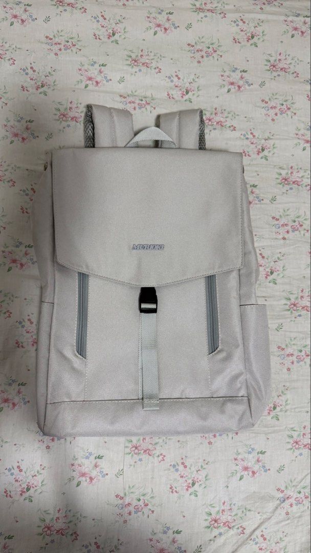 Murioki Grey Backpack (Category: Backpacks) located in Valenzuela. Submitted by .manel. (Listing ID 1423757922, Image 2). Description: Brand New just unboxed it to promote in black app. Selling it a little bit lower. AGAIN THIS IS BRAND NEW and auto pass and no to hagglers. Grey backpack features a flap closure with a buckle and a top handle. It has two side pockets and adjustable shoulder straps. The interior has multiple compartments and a zipp