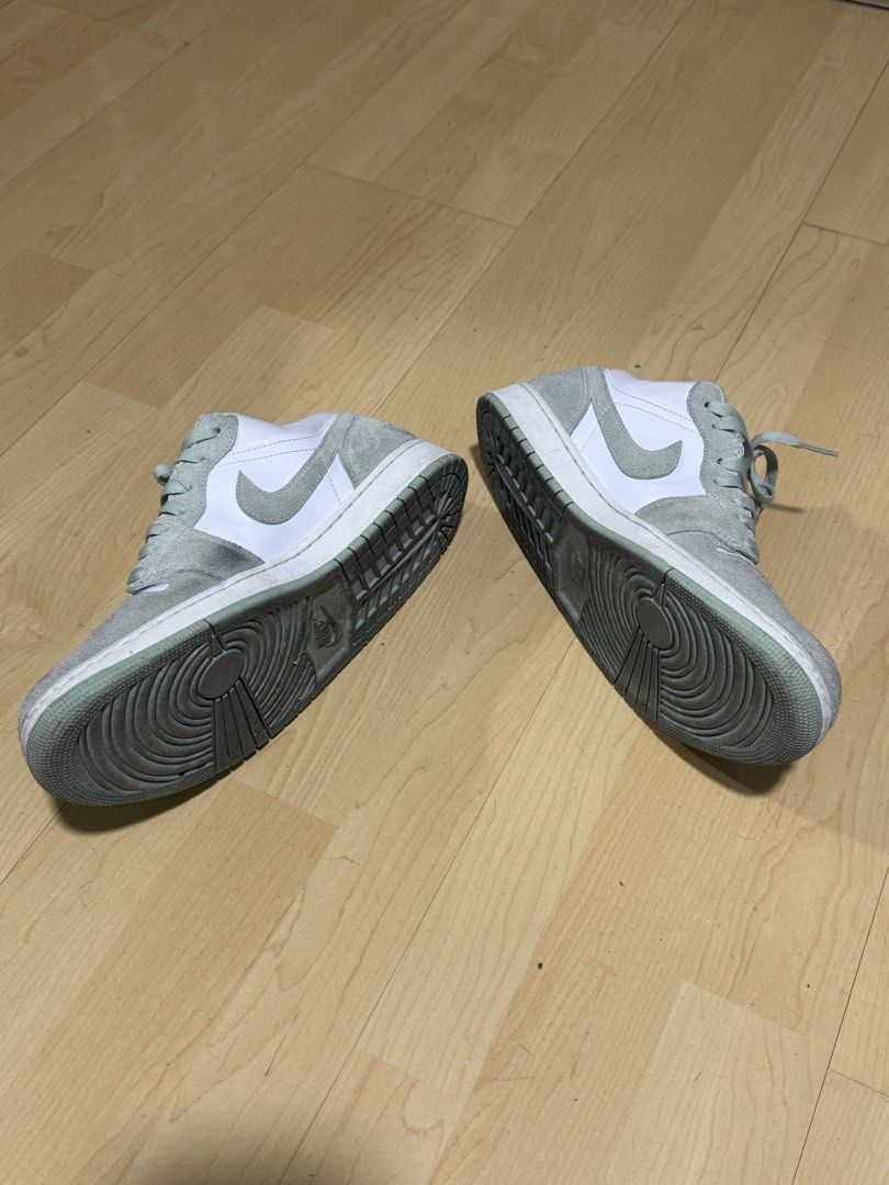 Nike Air Jordan 1 Low (Category: Sneakers) located in Mandaluyong City. Submitted by mr022 (Listing ID 1423665225, Image 2). Description: - Nike Air Jordan 1 Low sneakers - White and green color scheme - Low-top design - Features suede-like material on overlays - White midsole - Iconic Nike swoosh on sides - Matching green laces - slight dirt on suedes but can still be cleaned by deep cleaning For meet-up only RFS: need funds for medical bills.