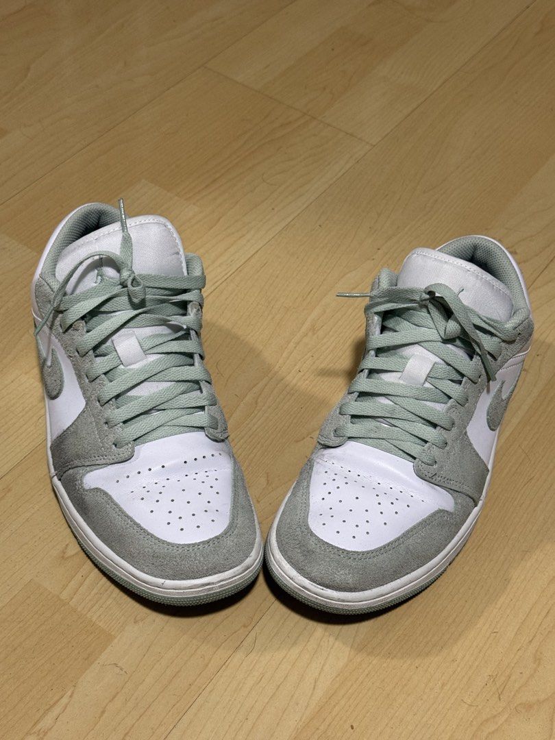 Nike Air Jordan 1 Low (Category: Sneakers) located in Mandaluyong City. Submitted by mr022 (Listing ID 1423665225, Image 3). Description: - Nike Air Jordan 1 Low sneakers - White and green color scheme - Low-top design - Features suede-like material on overlays - White midsole - Iconic Nike swoosh on sides - Matching green laces - slight dirt on suedes but can still be cleaned by deep cleaning For meet-up only RFS: need funds for medical bills.