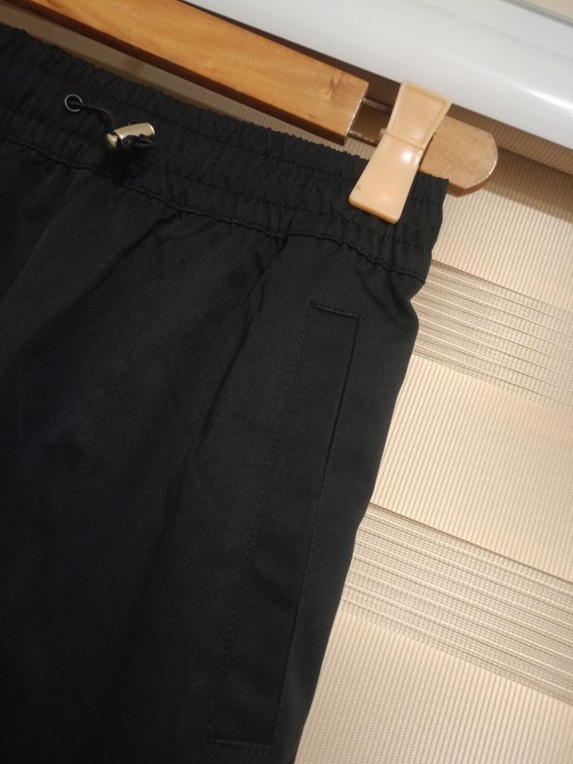 Nike Swoosh Woven Pants - Size S (Category: Joggers) located in Valenzuela. Submitted by One.Only.Nan (Listing ID 1423746994, Image 3). Description: Black Nike pants with an elastic waistband and drawstring. Features the Nike logo on the front. Includes pockets and elastic cuffs at the ankles. Made in China. Size S. Fits 28-30usm Length 38" MOP: GCASH MAYA AUB BPI VALENZUELA CITY LOC .