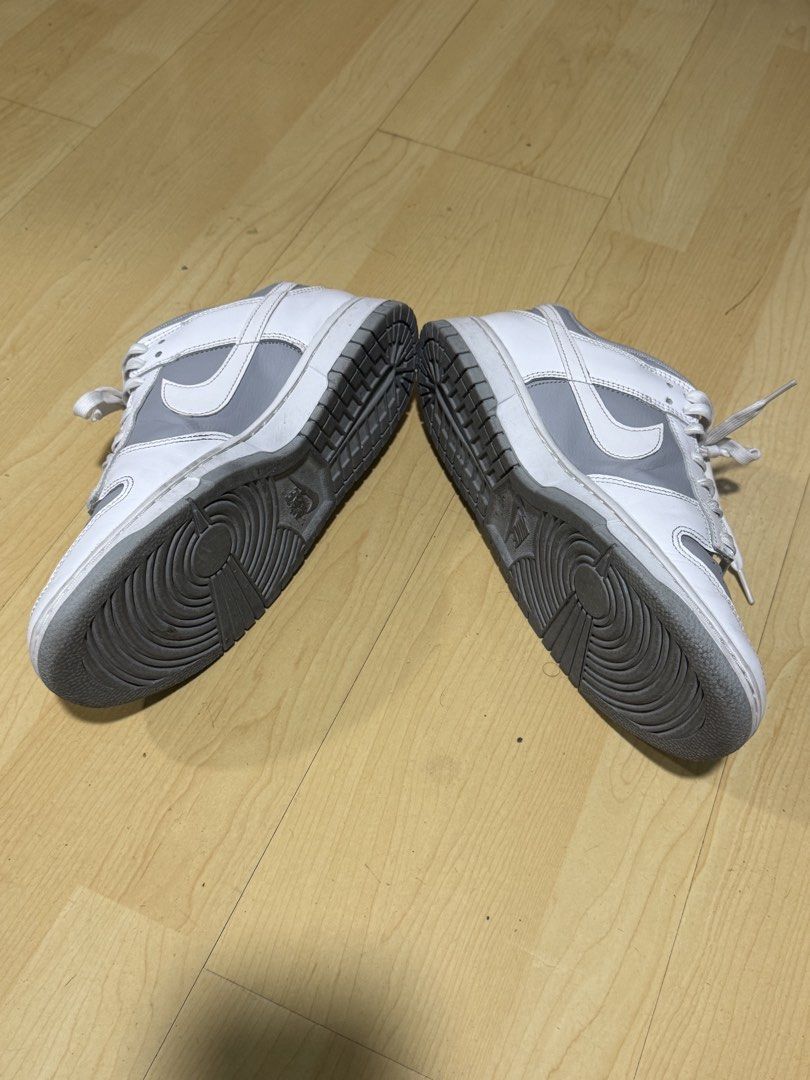 Nike Dunk Low Grey White (Category: Sneakers) located in Mandaluyong City. Submitted by mr022 (Listing ID 1423667081, Image 2). Description: - Nike Dunk Low - Color: Grey and White - Nike logo on side and heel - White laces - Grey sole and insoles -With few dirts and stain on laces. But still can be cleaned and removed For meet-up only RFS: need funds for medical bills.