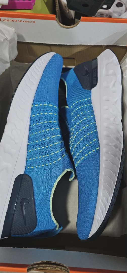Nike React Phantom Run Flyknit 2 (Category: Sneakers) located in Cavite. Submitted by live_once (Listing ID 1423648514, Image 3). Description: - Nike React Phantom Run Flyknit 2 - Color: Blue - Flyknit upper - Slip-on design - White React foam sole - Nike logo on side and insole - Includes original box Brand new Nike react phantom run fk 2 (size 12 US) Priced at 7k pesos selling low for only 2700 pesos RFS: wrong size.