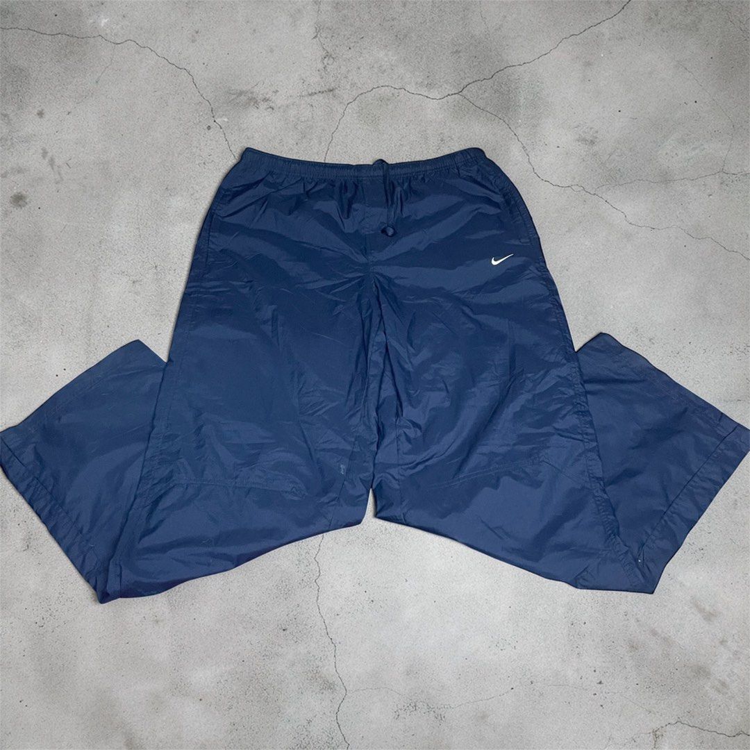 Nike Track Pants - Navy Blue (Category: Joggers) located in Quezon City. Submitted by thrifttogreatness (Listing ID 1423640439, Image 1). Description: - Navy blue Nike track pants - Elastic waistband with drawstring - Nike logo on front - Relaxed fit - Ideal for casual wear and workouts.