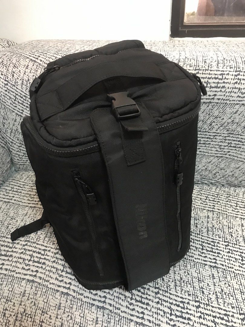 Nikon Camera Bag (Category: Camera Bags & Carriers) located in Calapan. Submitted by kimmieartsycraft (Listing ID 1423752164, Image 2). Description: - Black Nikon camera bag - Multiple compartments and pockets for organization - Padded shoulder strap for comfortable carrying - Top handle for easy carrying - Interior with zippered compartments and clear pockets.