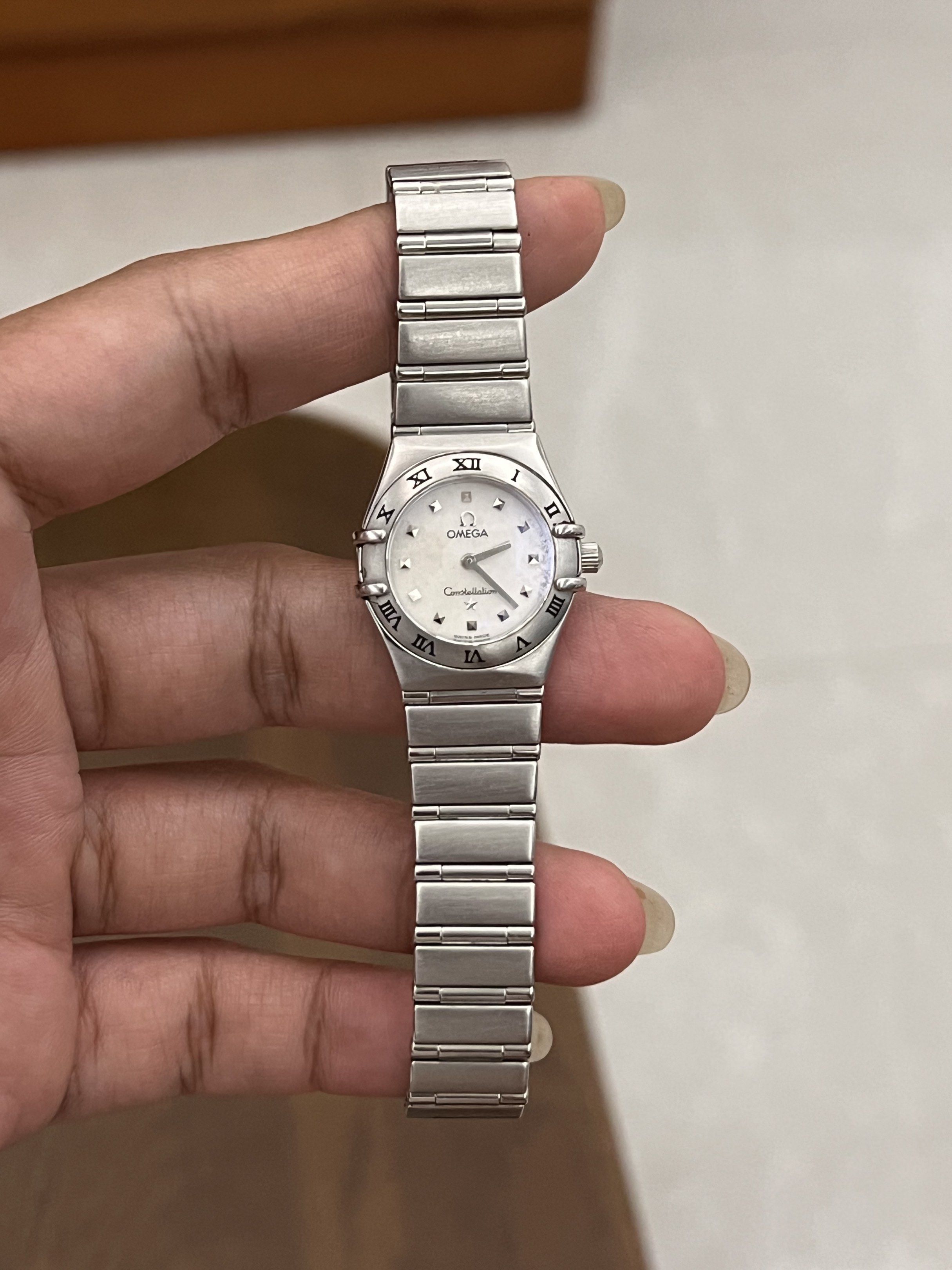 Authentic preloved Omega Constellation Ladies Watch (Category: Luxury Watches) located in San Pablo. Submitted by iamtrina (Listing ID 1423689198, Image 2). Description: Model 1561.71.00 23mm case size swiss Quartz white mother of pearl dial fixed engraved with Roman Numerals bezel max wrist size 15cm 9/10 condition Lightly polished Domed saphire crystal Deployment clasp Clasp with 18k solid gold Ω logo already valued at 10k Includes generic watc
