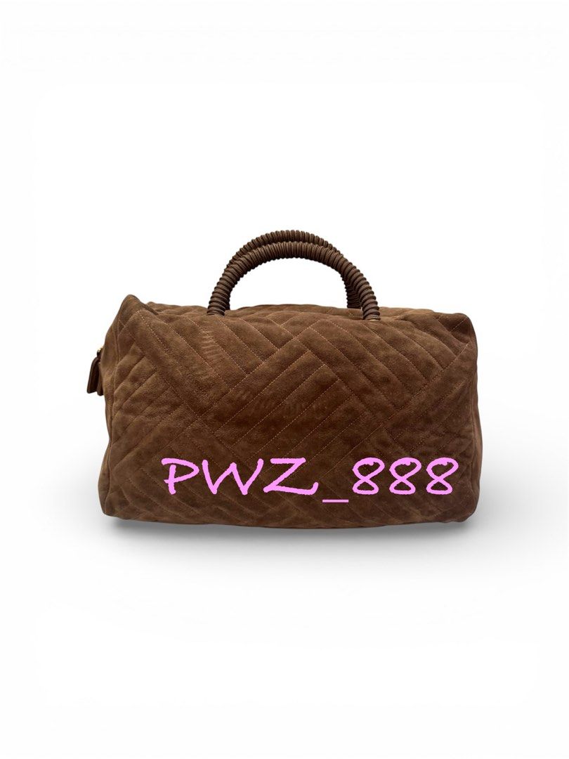Prada Suede Boston Bag (Category: Luxury Bags & Wallets) located in Baguio. Submitted by pwz-eshop (Listing ID 1423615697, Image 2). Description: • Please take time to read. • I do not reserve items. I only mark items as reserved when it is paid. Paid items are shipped the next day. No shipping on holidays. • I do not have when worn pictures, please rely on actual dimensions for sizing. • Up for Grabs!! • Guaranteed Authentic!! • Flaws: Bended ha