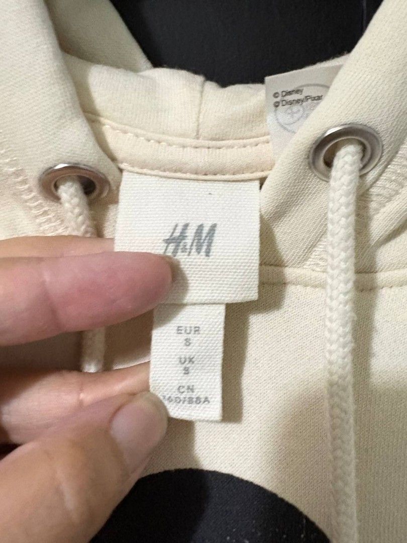 Pre-loved H&M Mickey Mouse Hoodie (Category: Hoodies) located in Manila. Submitted by Rhidell (Listing ID 1423621829, Image 3). Description: - Cream-colored H&M hoodie - Features a Mickey Mouse graphic - Size: S - Drawstring hood and long sleeves -small stain at the back hardly noticeable.