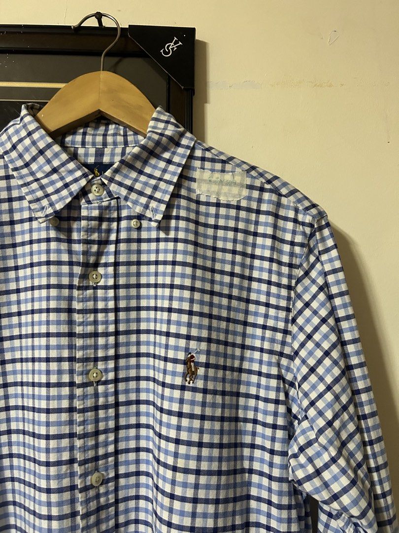 Ralph Lauren Checkered Long Sleeve Shirt (Category: Tshirts & Polo Shirts ) located in Lubao. Submitted by wtp_archive (Listing ID 1423764590, Image 2). Description: Ralph Lauren long sleeve checkered shirt. Button-down with collar, chest logo, and buttoned cuffs. Includes wooden hanger. 23x29.