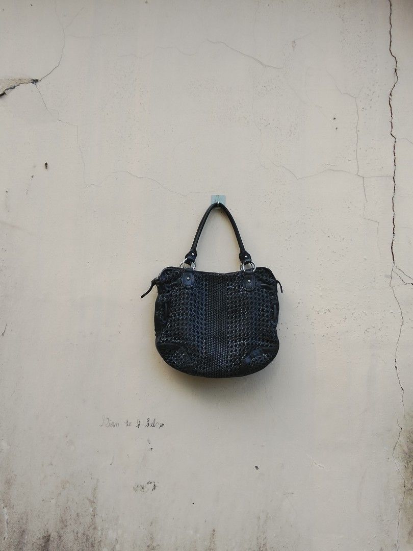 Sabrina Scala Black Woven Handbag (Category: Shoulder Bags) located in Quezon. Submitted by thrift.21 (Listing ID 1423680872, Image 1). Description: - Sabrina Scala black woven handbag - Double handles - Zippered closure - Interior zippered pocket - Patterned lining - Silver-tone hardware - Woven exterior design - Leather handles.