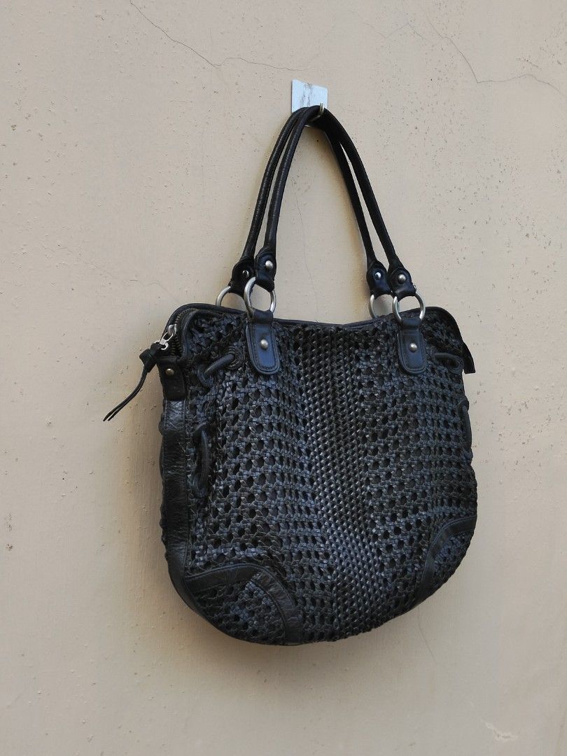 Sabrina Scala Black Woven Handbag (Category: Shoulder Bags) located in Quezon. Submitted by thrift.21 (Listing ID 1423680872, Image 2). Description: - Sabrina Scala black woven handbag - Double handles - Zippered closure - Interior zippered pocket - Patterned lining - Silver-tone hardware - Woven exterior design - Leather handles.
