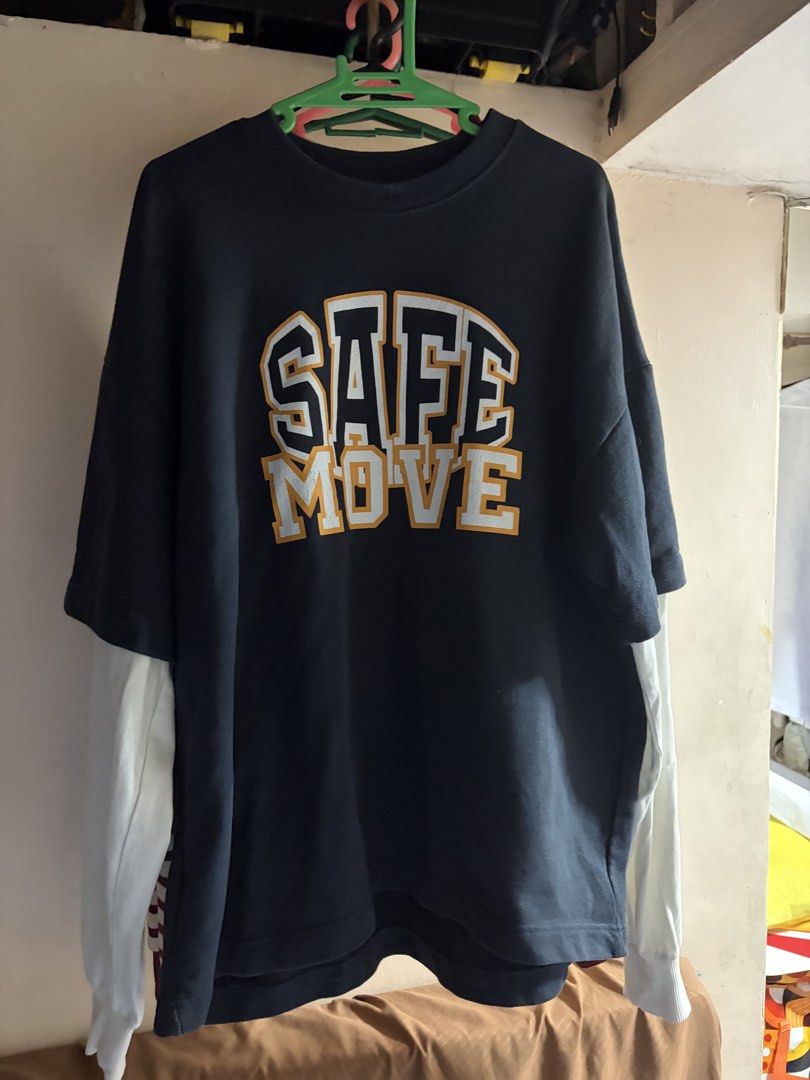 ZARA Safe Move Layered Oversized T-shirt (Category: Tshirts & Polo Shirts ) located in Manila. Submitted by xoffeee (Listing ID 1423711923, Image 1). Description: - Oversized t-shirt - Color: Navy blue body, white sleeves - Design: "SAFE MOVE" varsity print on chest - Sleeve detail: Checkered pattern on inner side - Style: Layered design.