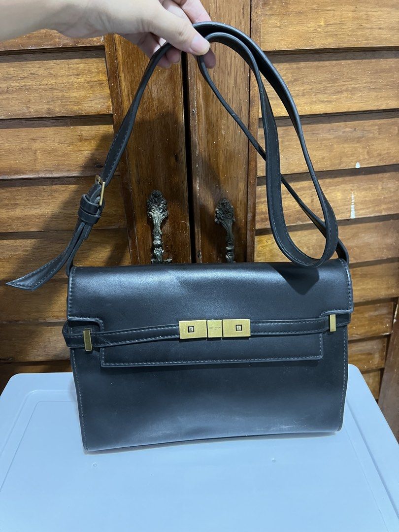 Saint Laurent Paris Black Shoulder Bag (Category: Luxury Bags & Wallets) located in Manila. Submitted by zoeykim16 (Listing ID 1423679199, Image 1). Description: - Saint Laurent shoulder bag - Black leather - Flap closure - Gold-tone metal clasp with Saint Laurent Paris logo - Adjustable shoulder strap - Rectangular shape -NGA only.