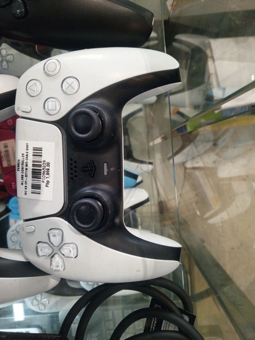 Sony PS5 DualSense Wireless Controller (Category: Controllers) located in Manila. Submitted by hernandezc00341 (Listing ID 1423649408, Image 3). Description: - Sony PS5 DualSense Wireless Controllers - Available Colors: White, Black, Blue, Red - Includes: Controller and Cable - Price: Indicated on labels - Please inquire for specific color availability..