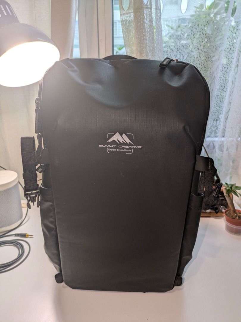 Summit Creative Weather Proof Backpack (Category: Camera Bags & Carriers) located in Muntinlupa City. Submitted by picklerphotographer (Listing ID 1423674674, Image 2). Description: - Summit Creative camera backpack - Durable and in black color - Multiple compartments and dividers for camera gear - Padded interior for protection - Adjustable straps for comfort - Comes with a box - Interior: Light blue lining with orange accents.