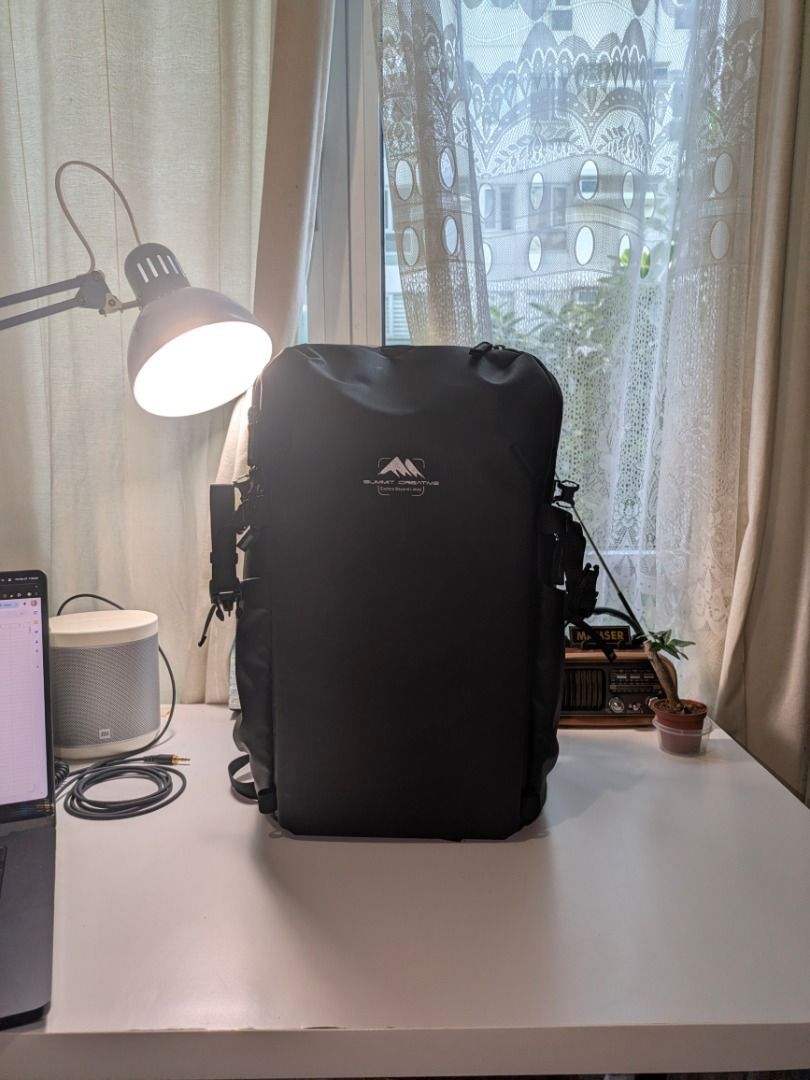 Summit Creative Weather Proof Backpack (Category: Camera Bags & Carriers) located in Muntinlupa City. Submitted by picklerphotographer (Listing ID 1423674674, Image 1). Description: - Summit Creative camera backpack - Durable and in black color - Multiple compartments and dividers for camera gear - Padded interior for protection - Adjustable straps for comfort - Comes with a box - Interior: Light blue lining with orange accents.