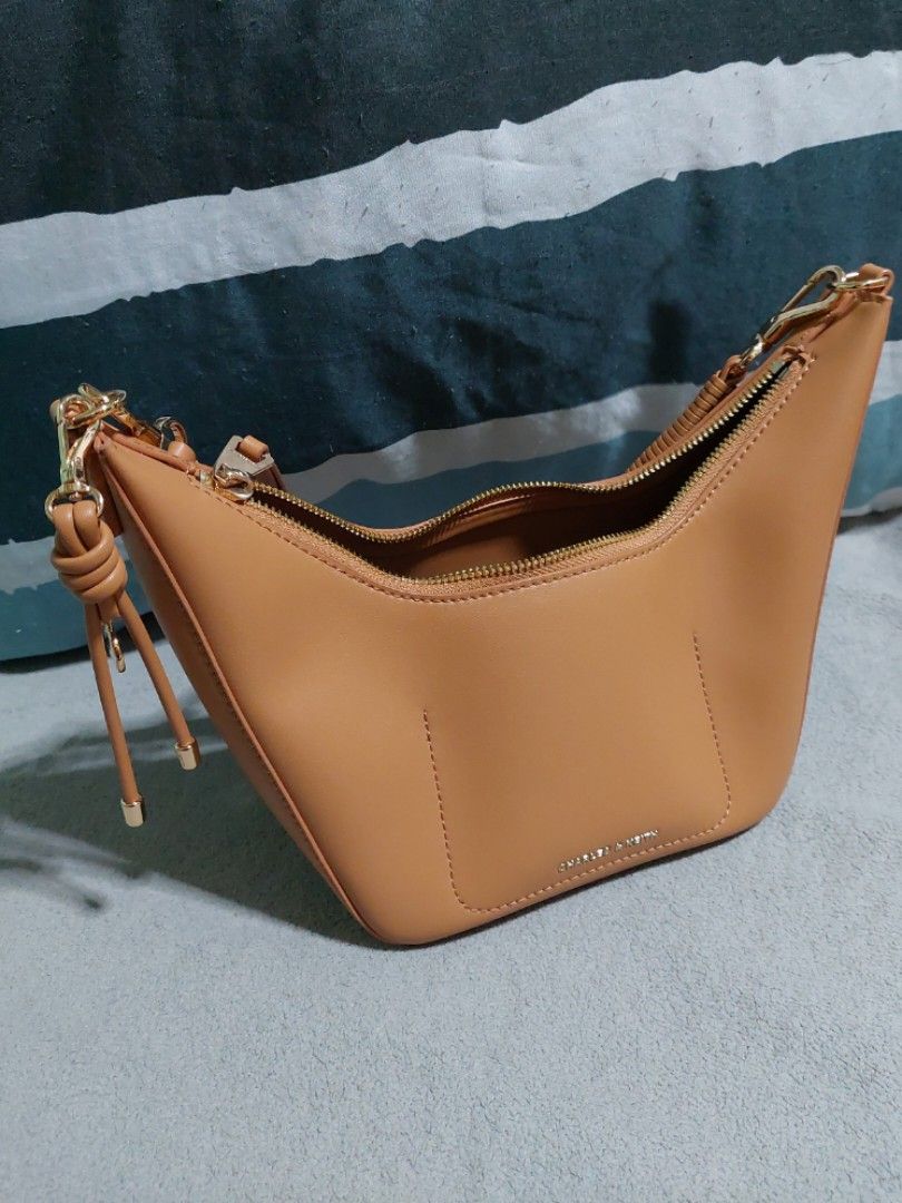 Tan Shoulder Bag (Category: Shoulder Bags) located in Paranaque City. Submitted by erick_e (Listing ID 1423706043, Image 1). Description: -1 pc Tan Charles & Keith shoulder Bag -Used with care - Zip closure - Lined interior - Neutral color, versatile for outfits -2300 Orig price -available for pick up by lala or grab -kindly chat or sms 0915 727 06 33 .