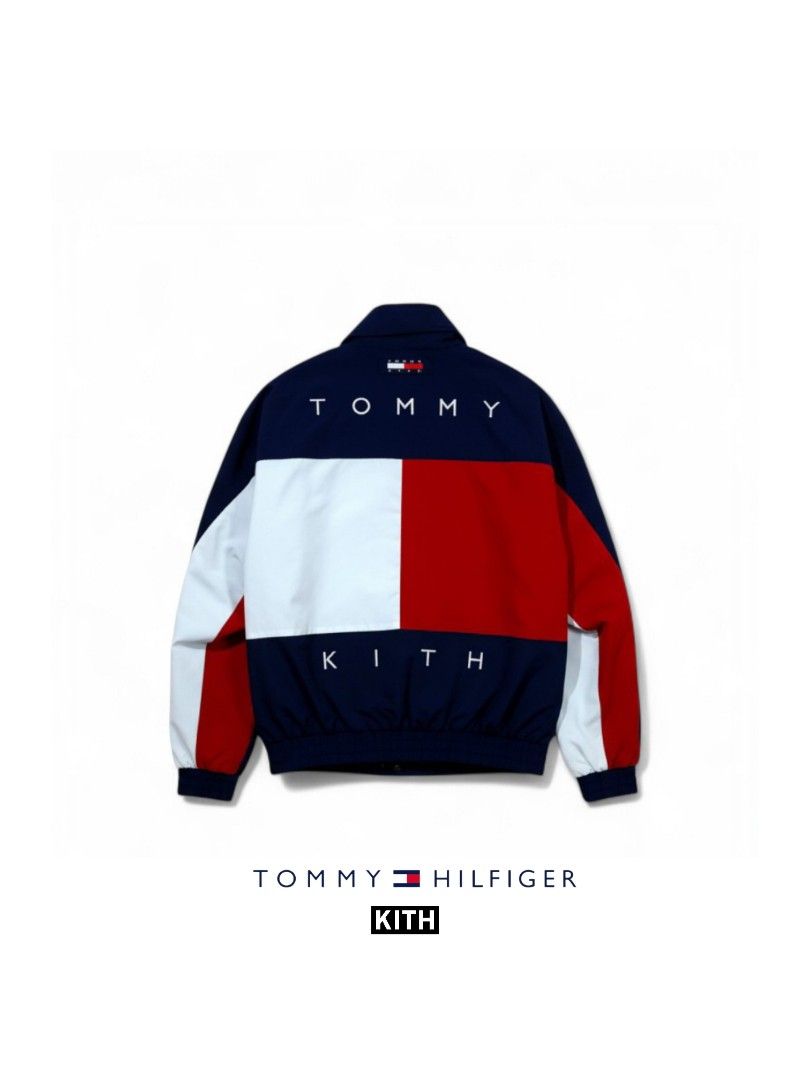 Tommy Hilfiger x Kith Reversible Windbreaker Jacket (Category: Coats, Jackets and Outerwear) located in Manila. Submitted by mf.classics (Listing ID 1409754781, Image 1). Description: - Tommy Hilfiger color block jacket - Features white, red, and navy blue panels - Zip-up front - Stand-up collar - Tommy Hilfiger and Kith logos - Blue exterior with red lining - Includes a small tag on the back - Issue: Reattached zipper puller - Measurements: 26 L
