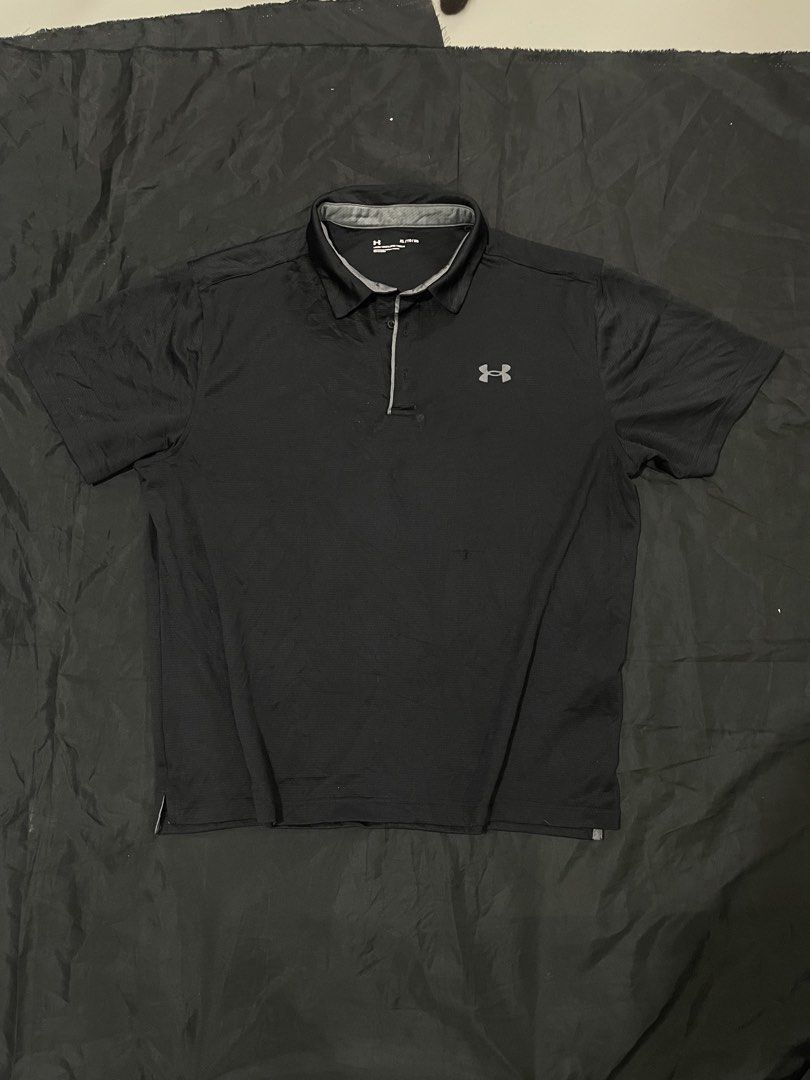 Under Armour Black Polo Shirt (Category: Tshirts & Polo Shirts ) located in Cavite. Submitted by rncthrifting (Listing ID 1423728364, Image 1). Description: 25 width 28 length - Black Under Armour polo shirt - Short-sleeved - Collared neckline - Quarter-zip closure - Under Armour logo on chest - Textured, breathable fabric - Ideal for athletic activities or casual wear.
