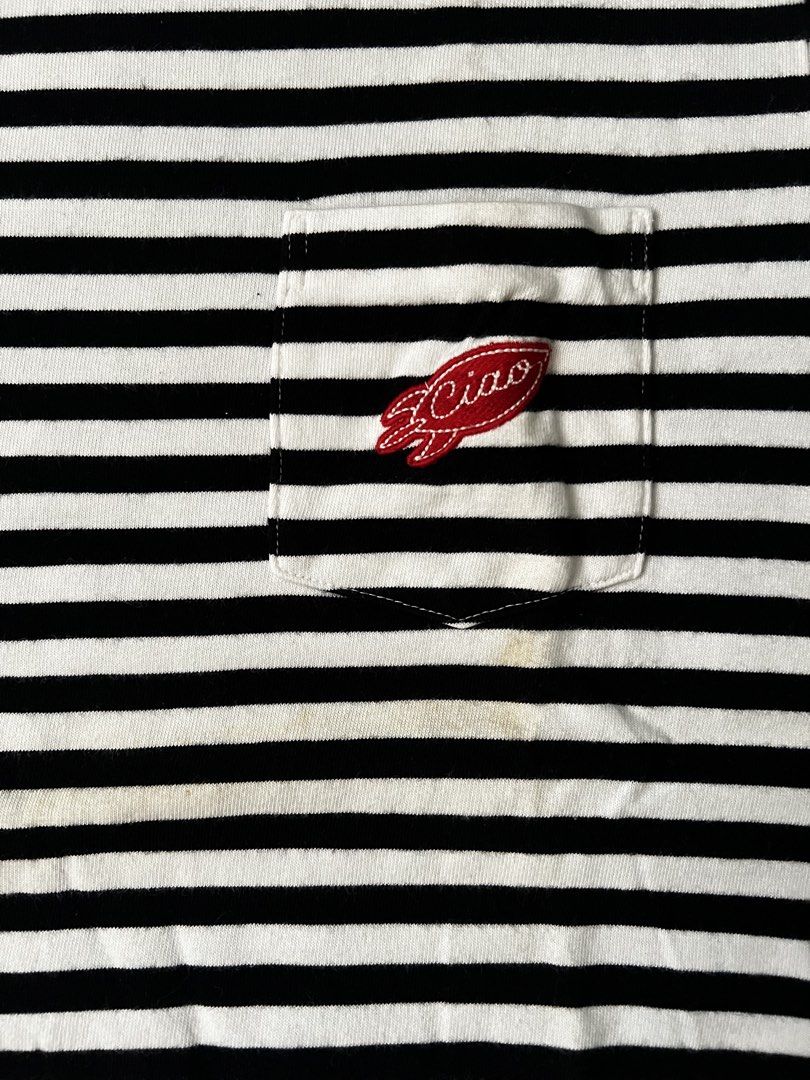 Uniqlo UT Ciao Striped Pocket Tee (Category: Tshirts & Polo Shirts ) located in Pasig City. Submitted by dawgshow (Listing ID 1423625608, Image 3). Description: - Uniqlo UT t-shirt - Classic black and white stripes - White crew neck - Features a small chest pocket with 'Ciao' logo - Standard fit, short sleeves - Made from a lightweight cotton blend - Ideal for everyday casual wear - Condition: Slight discoloration in midpart since due to storage 