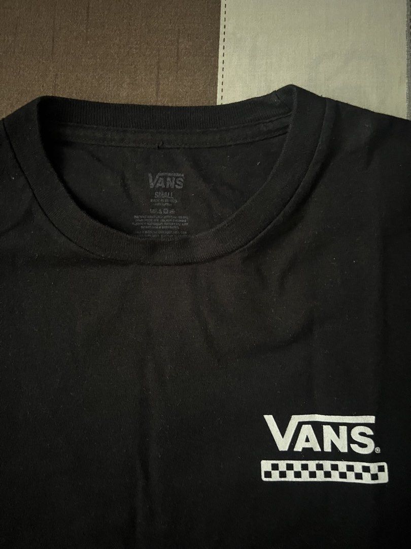 Vans Checkerboard T-shirt - Black (Category: Tshirts & Polo Shirts ) located in Pasig City. Submitted by dawgshow (Listing ID 1423625441, Image 2). Description: - Black Vans t-shirt - Size: Small - Front: Small checkerboard logo - Back: "OFF THE WALL" and "66" in checkerboard design - Rfs: Funds.