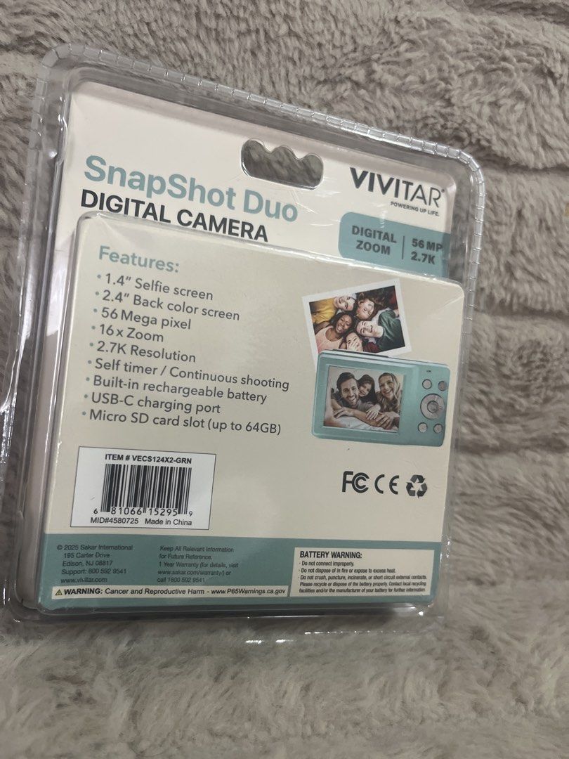 Vivitar Snapshot Duo Digital Camera (Category: Cameras) located in Pasig City. Submitted by jundbaptist21 (Listing ID 1423689627, Image 2). Description: Vivitar Snapshot Duo Digital Camera features a 1.4" selfie screen and a 2.4" back color screen. It has 56 Megapixels, 16x zoom, and 2.7K resolution. It includes a self-timer, continuous shooting, a built-in rechargeable battery, a USB-C charging port, and a micro SD card slot (up to 64GB). FROM U