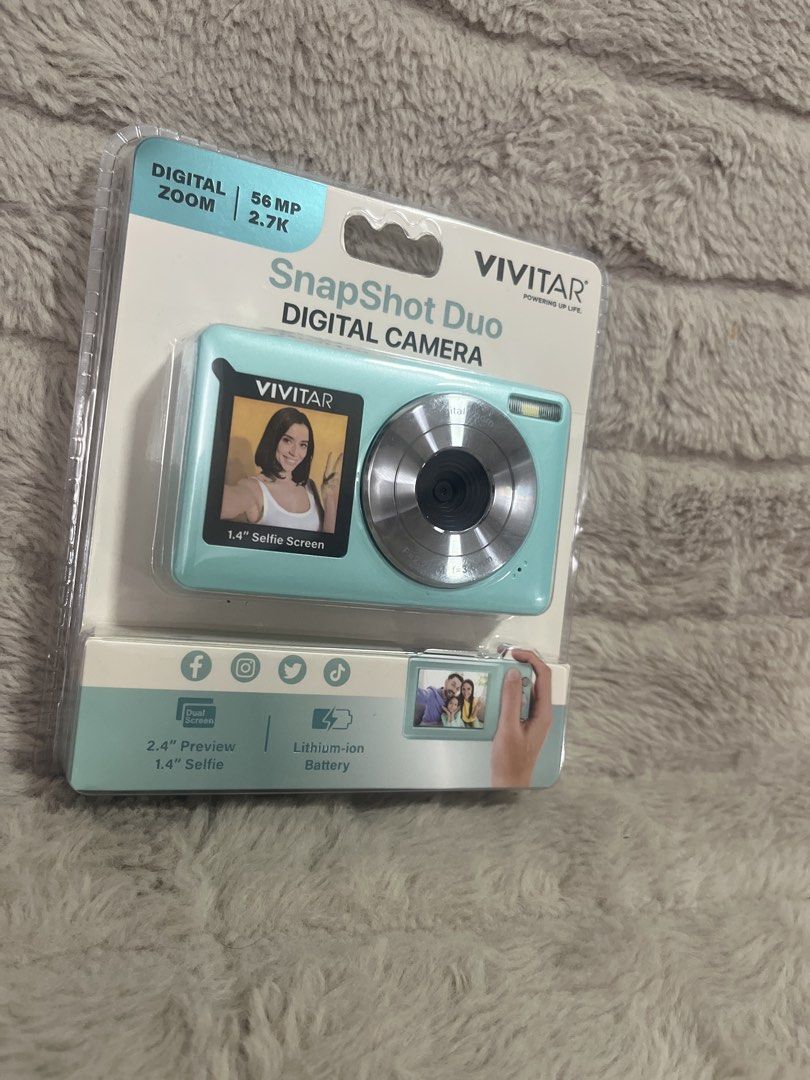Vivitar Snapshot Duo Digital Camera (Category: Cameras) located in Pasig City. Submitted by jundbaptist21 (Listing ID 1423689627, Image 1). Description: Vivitar Snapshot Duo Digital Camera features a 1.4" selfie screen and a 2.4" back color screen. It has 56 Megapixels, 16x zoom, and 2.7K resolution. It includes a self-timer, continuous shooting, a built-in rechargeable battery, a USB-C charging port, and a micro SD card slot (up to 64GB). FROM U