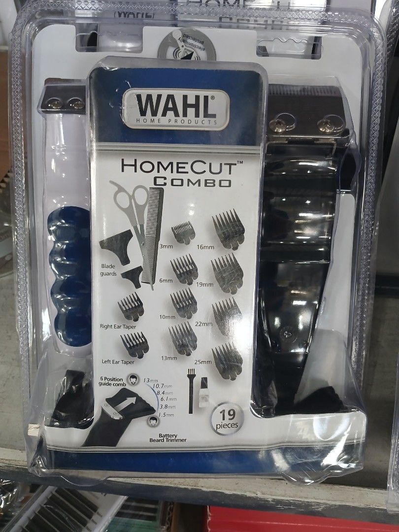 Wahl Homecut Combo Hair Clipper Set (Category: Hair) located in Manila. Submitted by sc_arvin (Listing ID 1423628128, Image 1). Description: Wahl Homecut Combo hair clipper set includes a clipper, various guide combs (3mm, 6mm, 10mm, 13mm, 16mm, 19mm, 22mm, 25mm), scissors, blade guards, and other accessories. It has 19 pieces in total. Perfect for home haircuts and grooming..