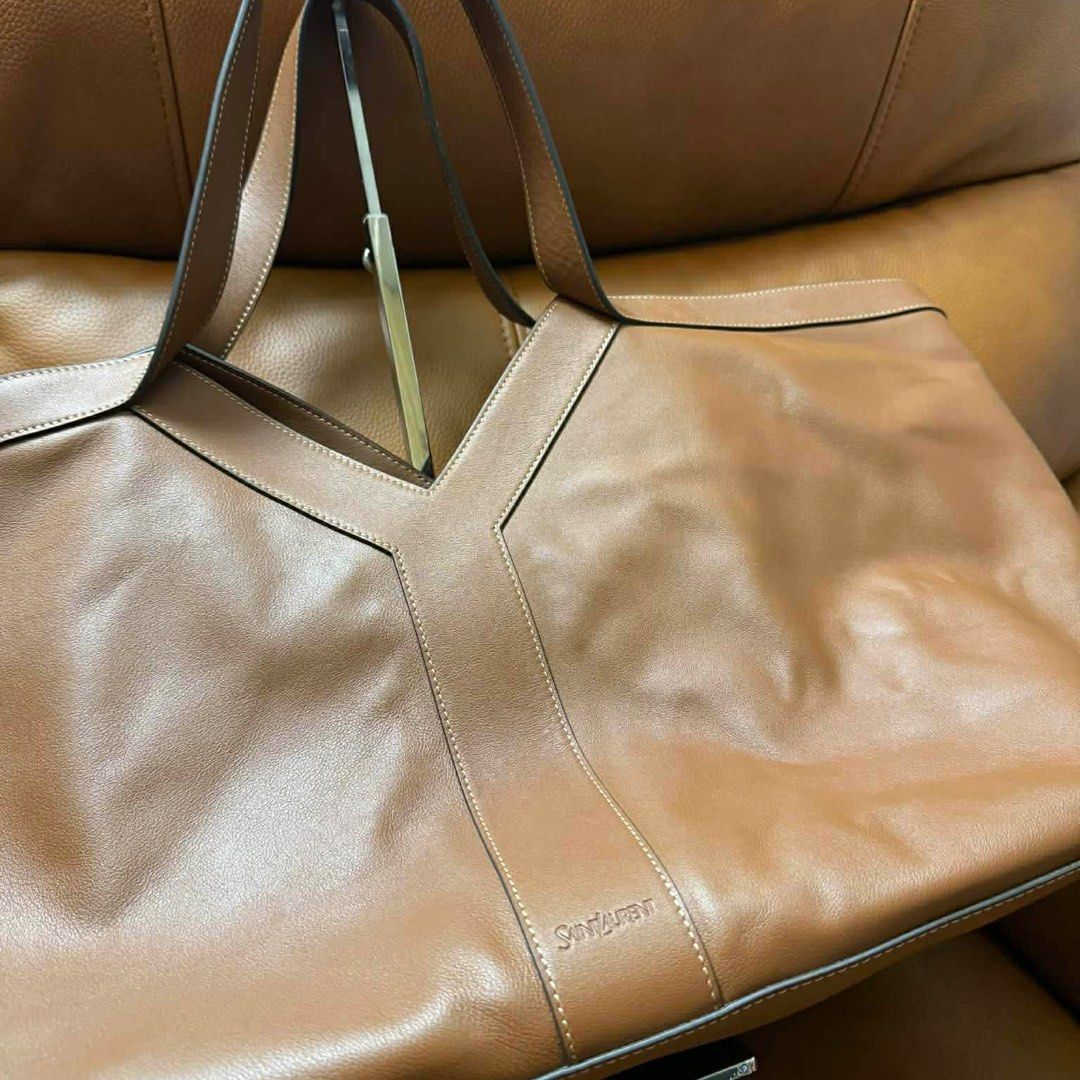 YSL Large Y Tote Bag (Category: Luxury Bags & Wallets) located in Pasay City. Submitted by angeeeende_ (Listing ID 1423757735, Image 2). Description: ‼️ not guaranteed ‼️ -in tan / camel brown (smooth leather) -signature stitched Y-panel with embossed Saint Laurent logo -spacious interior! perfect for work, travel, or everyday use -great condition 🫶🏻 🪷onhand, ready for delivery / pick up mode of payment: GCASH & Bank Transfer (BDO & BPI) payme