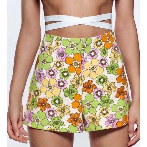 Zara Floral Print Shorts (Category: Shorts) located in Mandaluyong City. Submitted by chasingbliss (Listing ID 1423665728, Image 1). Description: - Zara floral shorts - Features a vibrant floral print (green, orange, purple) - High-waisted - Made of woven fabric - Great for casual outfits.