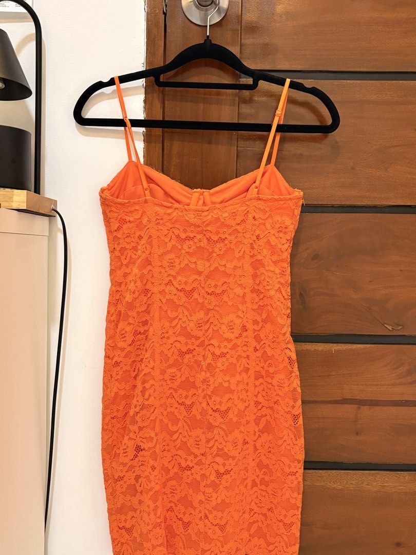 ZARA Orange Lace Mini Dress (Category: Dresses) located in Manila. Submitted by gelasprc (Listing ID 1423658986, Image 3). Description: - Vibrant orange mini dress - Delicate lace detailing - Bustier-style bodice - Thin spaghetti straps - Form-fitting design - Ideal for special occasions.