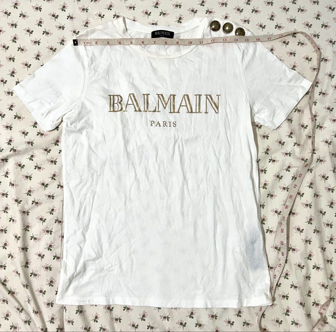 Sale!! Authentic / Original Balmain Paris Tshirt (Category: Luxury Apparel) located in Manila. Submitted by anything4less (Listing ID 1423946826, Image 3). Description: Sale!! Authentic / Original Balmain Paris Tshirt with gold font color and shoulder hardware. Alam ko sa Hong Kong niya nabili yan dati. Mabilisang post lang ulit guys kasi sobrang busy. Andiyan na details. Hehe. ✌🏻 mga nakalkal sa maids quarters namin na mga lumang damit. Ayaw na