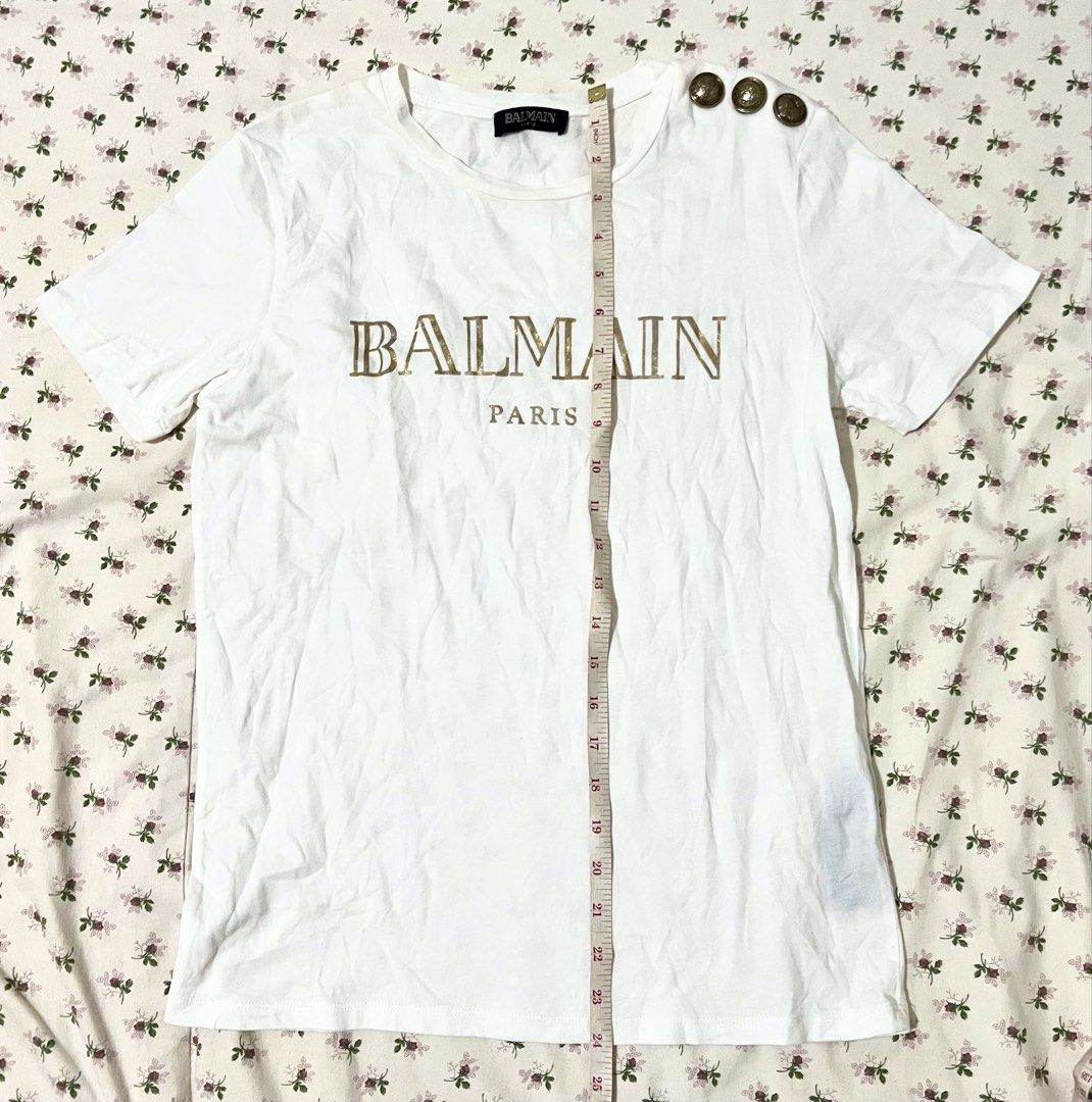 Sale!! Authentic / Original Balmain Paris Tshirt (Category: Luxury Apparel) located in Manila. Submitted by anything4less (Listing ID 1423946826, Image 2). Description: Sale!! Authentic / Original Balmain Paris Tshirt with gold font color and shoulder hardware. Alam ko sa Hong Kong niya nabili yan dati. Mabilisang post lang ulit guys kasi sobrang busy. Andiyan na details. Hehe. ✌🏻 mga nakalkal sa maids quarters namin na mga lumang damit. Ayaw na