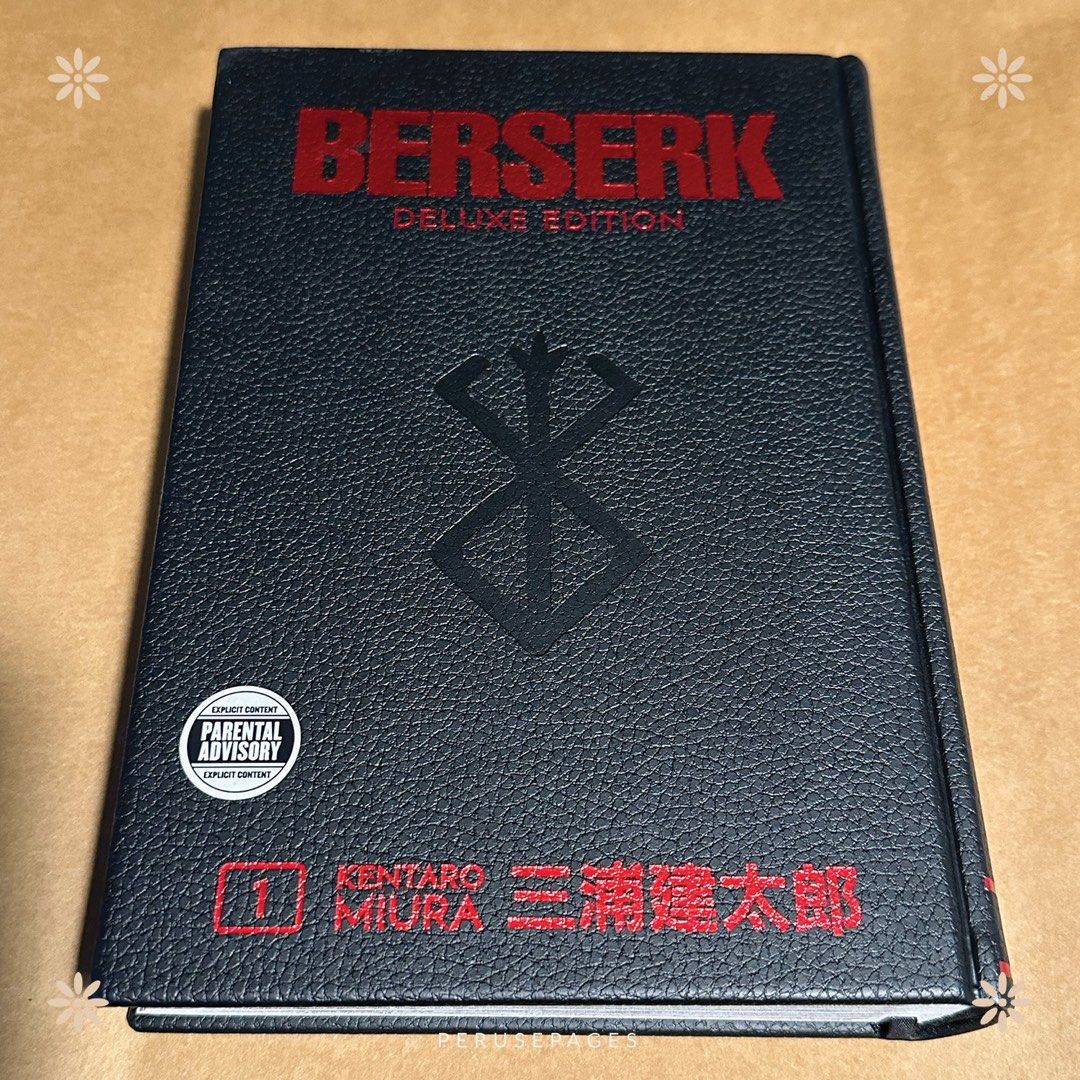 Berserk Deluxe Edition Volume 1 (Category: Comics & Manga) located in Pasig City. Submitted by seokchinicart (Listing ID 1423793396, Image 2). Description: - Berserk Deluxe Edition Volume 1 - By Kentaro Miura - Features the iconic Berserk logo and artwork - Includes parental advisory sticker - Preloved condition - Includes barcode and publisher information.