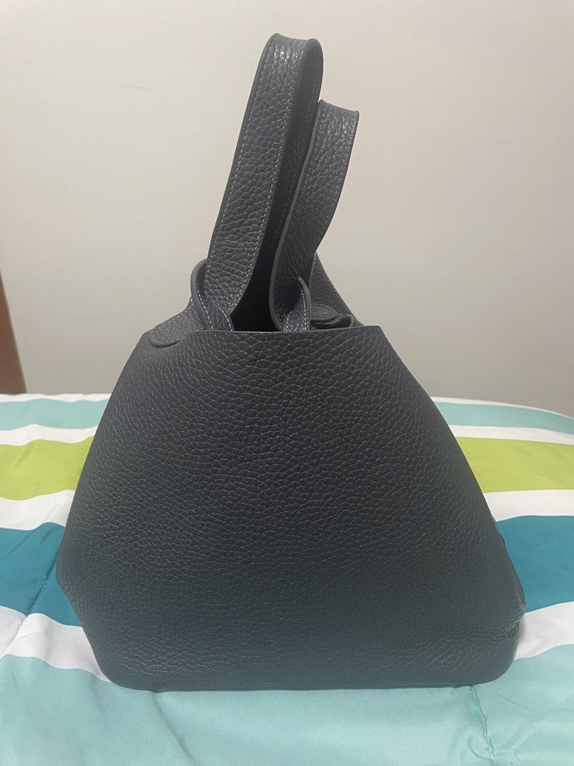 Black Leather Bucket Bag with Top Handle (Category: Shoulder Bags) located in Manila. Submitted by misyeli (Listing ID 1423926118, Image 2). Description: - Stylish black bucket /hand bag - Pebbled leather - Features a top handle - Textured exterior - Structured design - Simple and elegant look - Comfortable to carry - Durable material - Ideal for everyday use.