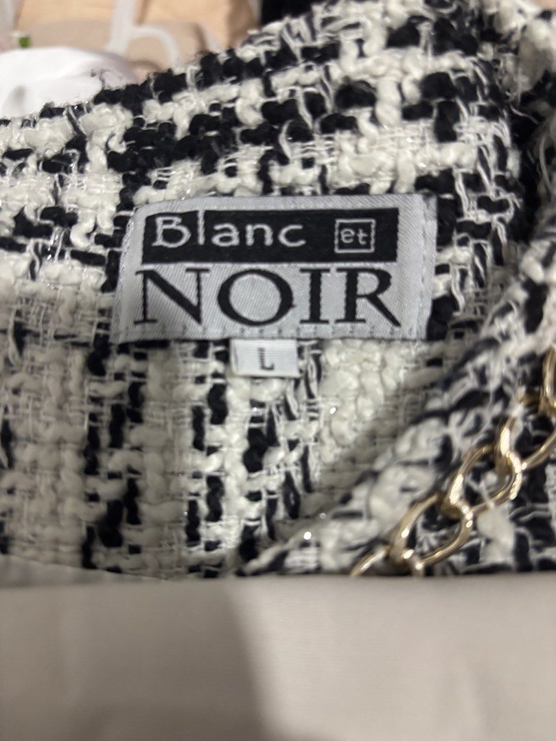 Blanc et Noir Tweed Dress (Category: Dresses) located in Caloocan City. Submitted by youngcloud_6ad805 (Listing ID 1423920139, Image 3). Description: - Blanc et Noir tweed dress - Classic black and white plaid pattern - Sleeveless design - Round neckline - Decorative chain detail - Faux pockets with chain accents - Zipper closure at the back - Size L but it can fit Small to medium (makapal kasi yung tela kaya kung tignan malaki) +sf thru jnt or f