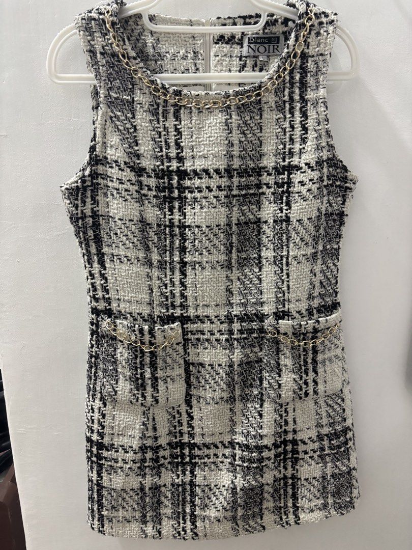 Blanc et Noir Tweed Dress (Category: Dresses) located in Caloocan City. Submitted by youngcloud_6ad805 (Listing ID 1423920139, Image 1). Description: - Blanc et Noir tweed dress - Classic black and white plaid pattern - Sleeveless design - Round neckline - Decorative chain detail - Faux pockets with chain accents - Zipper closure at the back - Size L but it can fit Small to medium (makapal kasi yung tela kaya kung tignan malaki) +sf thru jnt or f