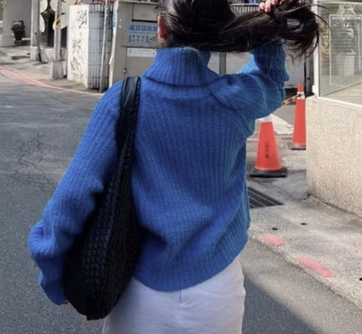 Blue Turtleneck Cropped Sweater (Category: Longsleeves) located in Pasig City. Submitted by decluttertrends (Listing ID 1423935455, Image 3). Description: - Trendy cropped blue sweater - Features a classic turtleneck - Long sleeves for warmth - Made with textured knit fabric - Versatile for various outfits.