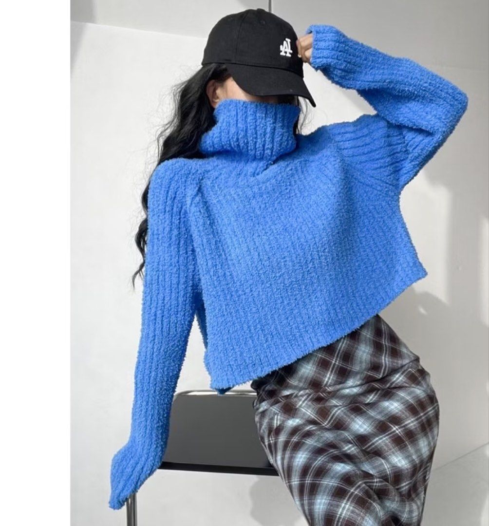 Blue Turtleneck Cropped Sweater (Category: Longsleeves) located in Pasig City. Submitted by decluttertrends (Listing ID 1423935455, Image 1). Description: - Trendy cropped blue sweater - Features a classic turtleneck - Long sleeves for warmth - Made with textured knit fabric - Versatile for various outfits.