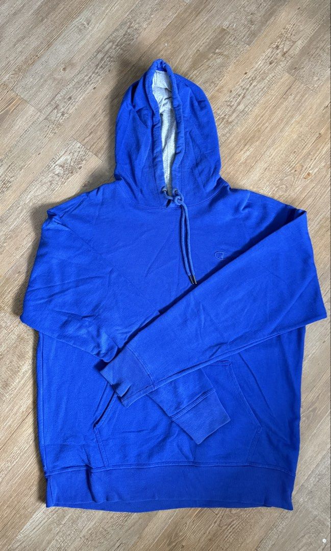 Champion Blue Hoodie (Category: Hoodies) located in San Pablo. Submitted by chinitokiddd (Listing ID 1423864628, Image 1). Description: - Champion hoodie - Vibrant blue color - Size: L/G - Drawstring hood - Champion logo on chest - Light grey hood lining - Made in Honduras.