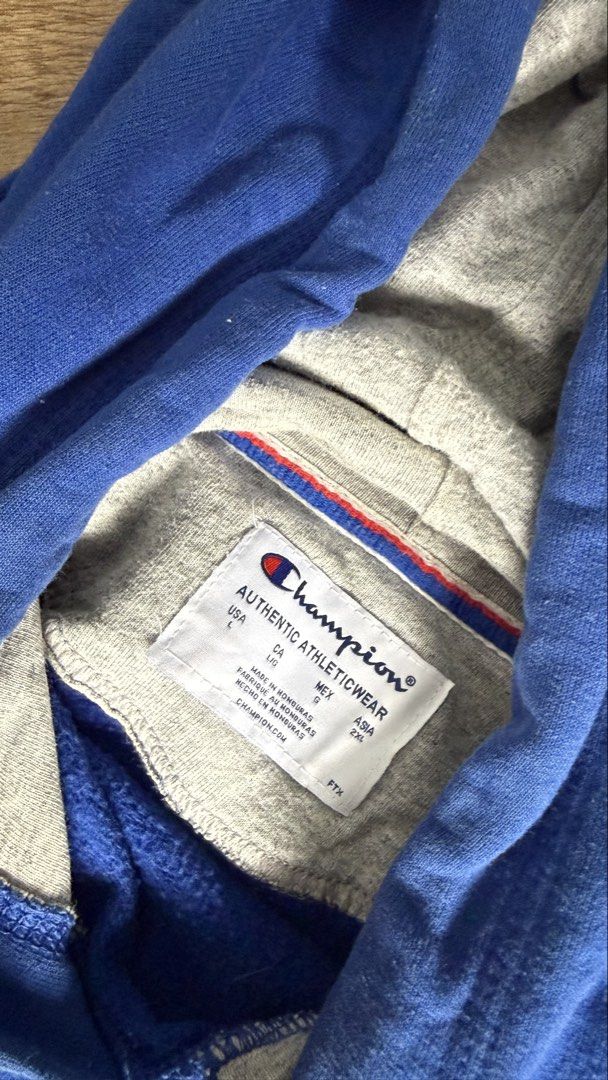 Champion Blue Hoodie (Category: Hoodies) located in San Pablo. Submitted by chinitokiddd (Listing ID 1423864628, Image 3). Description: - Champion hoodie - Vibrant blue color - Size: L/G - Drawstring hood - Champion logo on chest - Light grey hood lining - Made in Honduras.