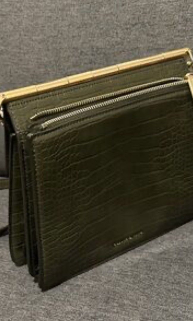 Charles & Keith Green Croc Crossbody Bag (Category: Cross-body Bags) located in Antipolo. Submitted by decluttering.shopph (Listing ID 1423969236, Image 2). Description: Charles & Keith green crossbody bag. Features a croc-embossed finish, gold hardware, and chain strap. Includes top handle, zippered pocket, and compartments. Rectangular shape..