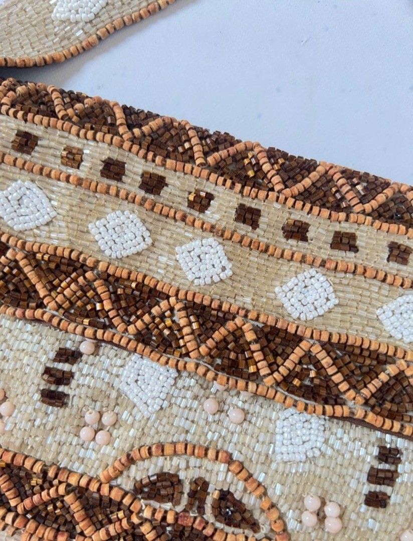 Christiana Beaded vintage Handbag (Category: Shoulder Bags) located in Manila. Submitted by thewalkingmuse (Listing ID 1423883399, Image 3). Description: - Christiana beaded shoulder bag - Detailed pattern in brown, white, and beige beads - Features a top handle - Magnetic closure - Lined with brown fabric bought this from another seller here for 4k pesos and never really got the chance to use it.selling it for such a cheap price already flaws: s
