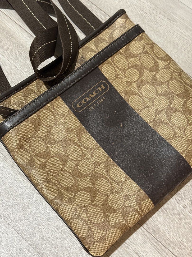Coach Signature Crossbody Bag (Category: Luxury Bags & Wallets) located in Makati City. Submitted by alonfinds (Listing ID 1423942151, Image 2). Description: - Heritage Stripe Slim Shoulder Bag or Heritage Signature Small Zip Top Crossbody. - Model Number F70591. - Signature PVC coated canvas with leather accents and silver-tone hardware. .