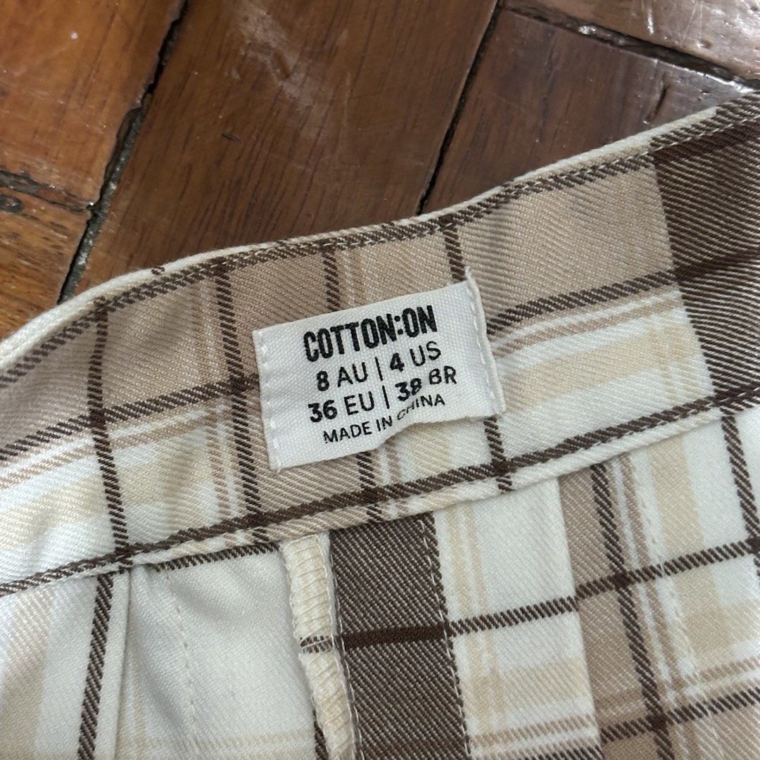 Cotton On Plaid Pleated Skirt (Category: Skirts) located in Quezon City. Submitted by blou_a (Listing ID 1423957049, Image 2). Description: Cotton On Plaid Pleated Mini Skirt Size 8 AU / 4 US (fits XS–S) Brown & beige plaid pattern High-waisted Flattering pleated silhouette Condition: Good RFS: Decluttering .