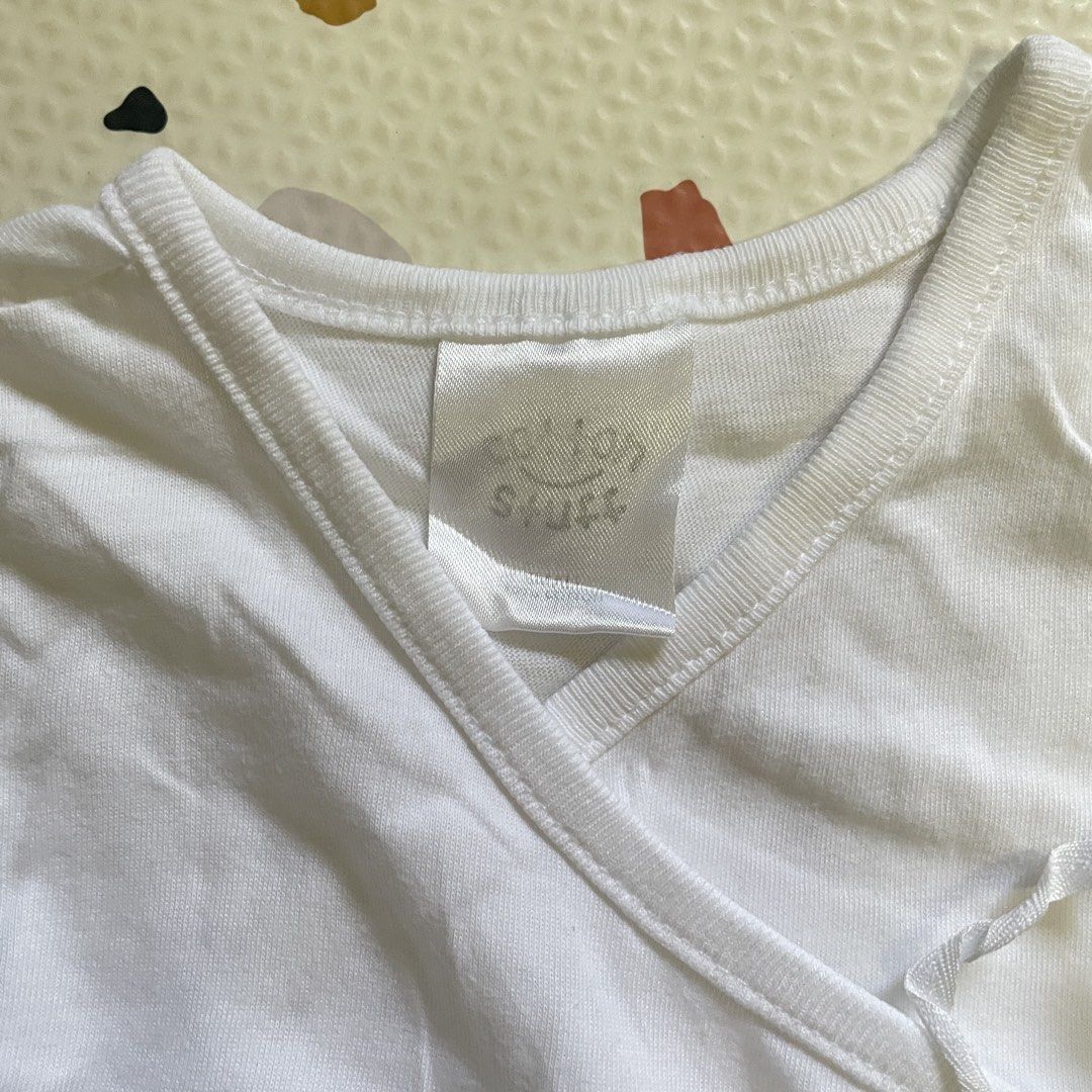 Cotton Stuff Tie Side Sleeveless Shirt Sando (Category: Babies & Kids Fashion) located in Las Pinas. Submitted by __iwn (Listing ID 1423922815, Image 2). Description: Rfs: outgrown *1 top has yellowish stain- can be cleaned -Brand: Cotton Stuff - Design: Wrap with tie closures - Sleeveless - Material: Cotton - Suitable for newborns and infants - Ideal for everyday use Loc: Las Pinas SF c/o buyer Payment prior delivery.