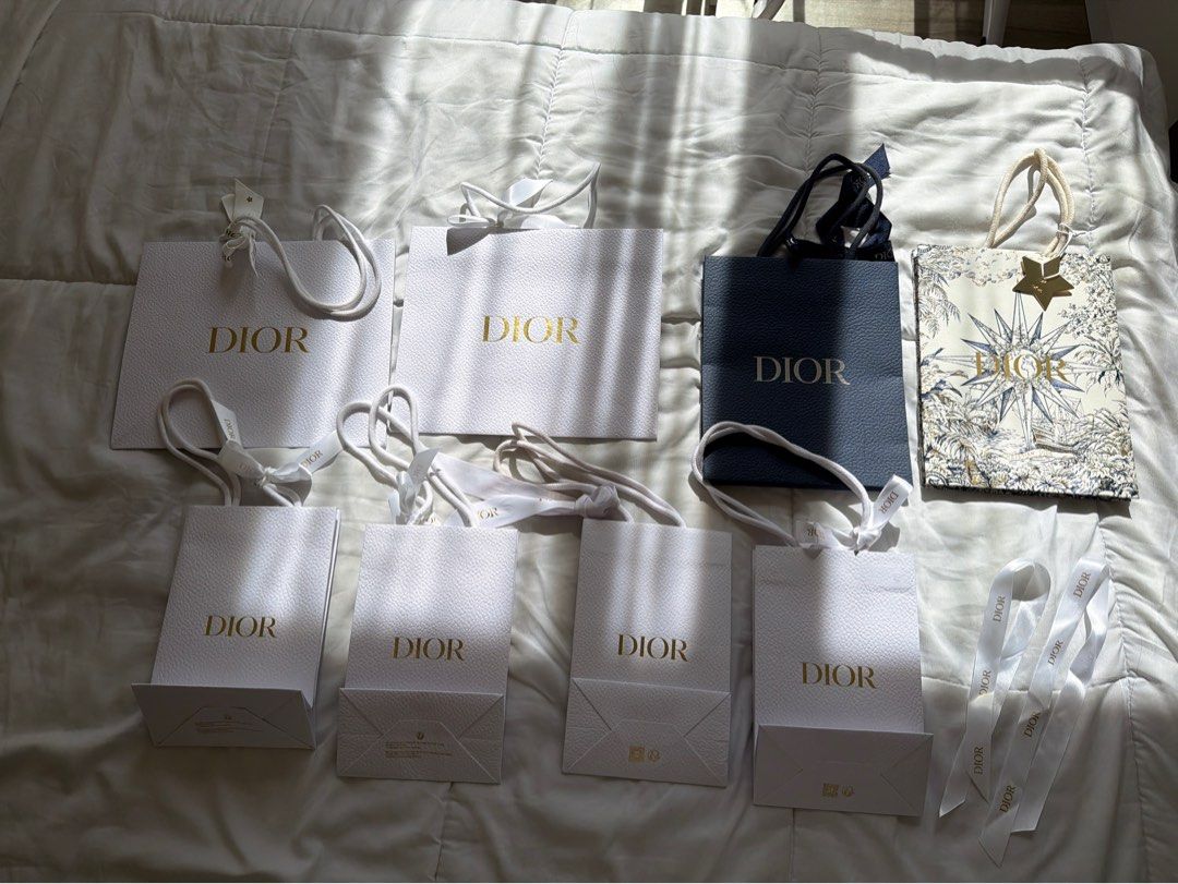 Dior Paper Bags Assorted Sizes (Category: Luxury Bags & Wallets) located in Taguig. Submitted by itsmariaangela (Listing ID 1423852640, Image 1). Description: - PM for individual prices. Take all for 2500 - Authentic Dior paper bags - Assorted sizes - Colors: White and Navy Blue - Some with handles and ribbons - Features the Dior logo in gold - Perfect for gifting or collecting.