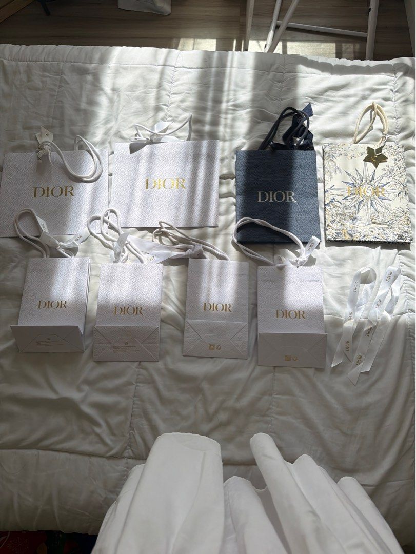 Dior Paper Bags Assorted Sizes (Category: Luxury Bags & Wallets) located in Taguig. Submitted by itsmariaangela (Listing ID 1423852640, Image 2). Description: - PM for individual prices. Take all for 2500 - Authentic Dior paper bags - Assorted sizes - Colors: White and Navy Blue - Some with handles and ribbons - Features the Dior logo in gold - Perfect for gifting or collecting.