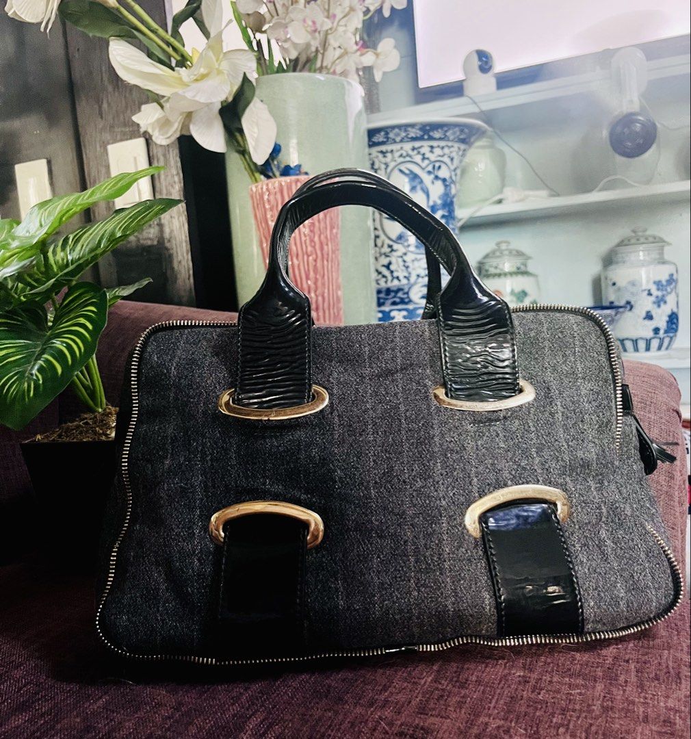 Emporio Armani (Category: Luxury Bags & Wallets) located in Quezon City. Submitted by retann (Listing ID 1423971741, Image 1). Description: - Stylish gray fabric handbag - Black accents and details - Structured shape - Secure zipper closure - Dual top handles - Elegant gold-toned hardware - Black patent leather accents.