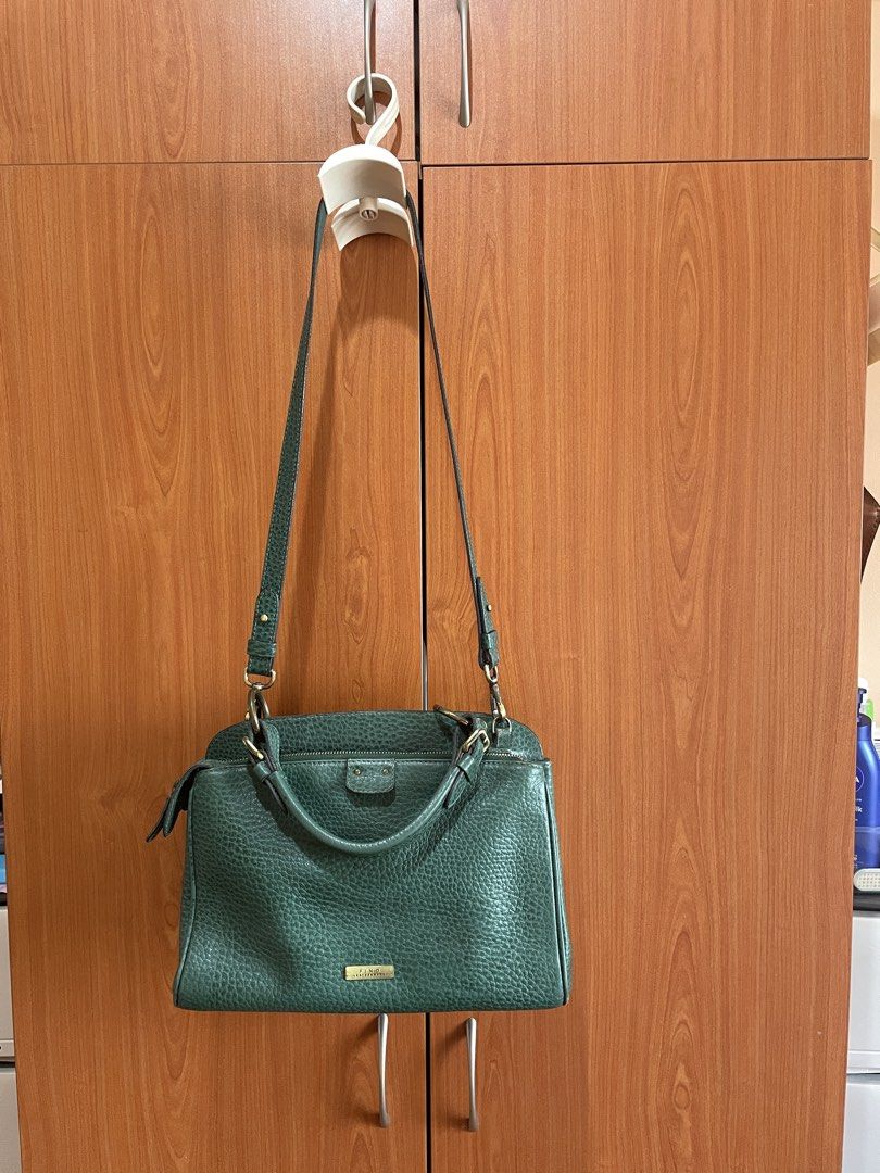 Fino Leather Bag (Category: Shoulder Bags) located in Makati City. Submitted by happycloset08 (Listing ID 1423818760, Image 2). Description: Selling my pre-loved Green Fino bag. It has 2 compartments. Spacious enough to carry all things for work or personal..