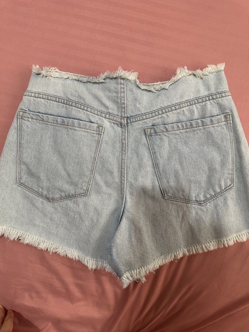 Forever 21 Denim Shorts (Category: Shorts) located in Antipolo. Submitted by decluttertosave (Listing ID 1423860674, Image 2). Description: - Forever 21 denim shorts - Light wash - Size 27 - Frayed hem - Classic five-pocket design - Waist: approximately 14 inches across - Made in Pakistan - Perfect for casual wear.